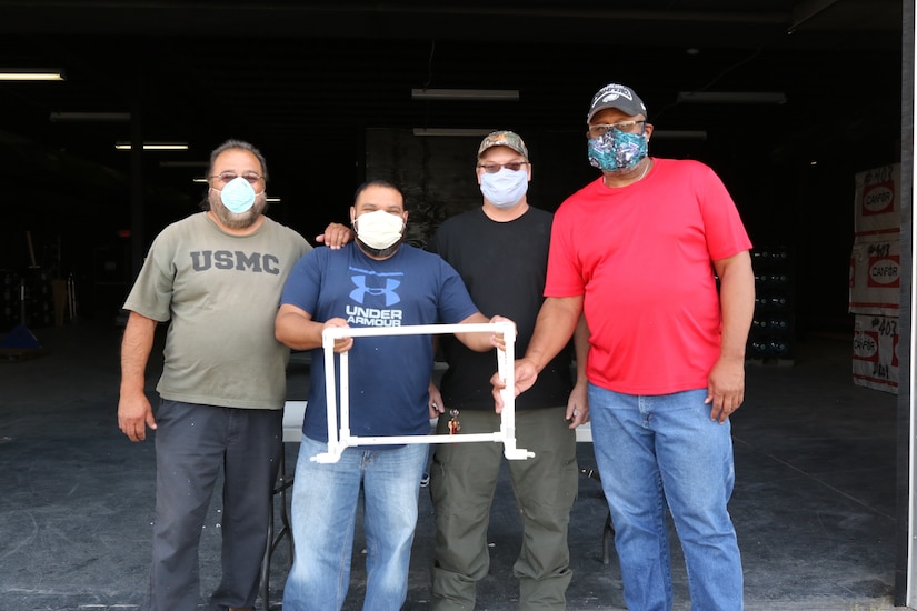 Maintenance workers assembling a CAMIC.