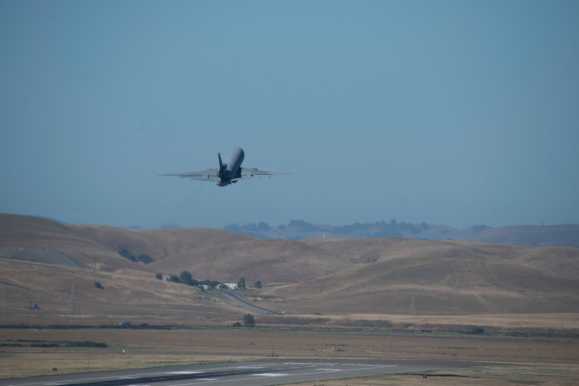 A KC-10 Extender takes off from the runway at Travis Air Force Base, California, May 27, 2020. The KC-10 is a refueling aircraft capable of carrying 356,000 pounds of fuel and transporting 170,000 pounds of cargo. (U.S. Air Force photo by Tech. Sgt. James Hodgman)
