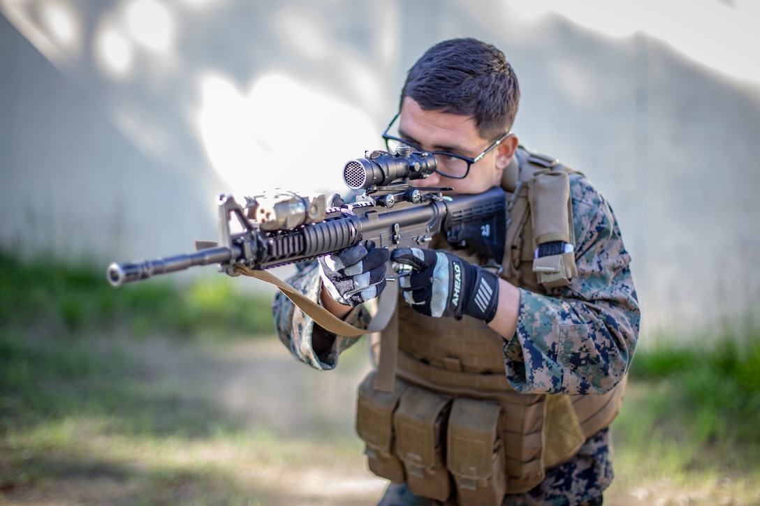 Sgt. William Chi, a military policeman with Special Purpose Marine Air-Ground Task Force - Southern Command, explains room-clearing techniques to Marines during a field exercise at Camp Lejeune, North Carolina, May 7, 2020. The Marines train and perform a variety of infantry skill evaluations during the field exercise to help sharpen their overall capabilities. These training events assist the Marines and Sailors when working alongside partner nations in Latin America and the Caribbean with crisis response preparedness, security cooperation training, and engineering projects. Chi is a native of Fontana, California. (U.S. Marine Corps photo by Cpl. Benjamin D. Larsen)