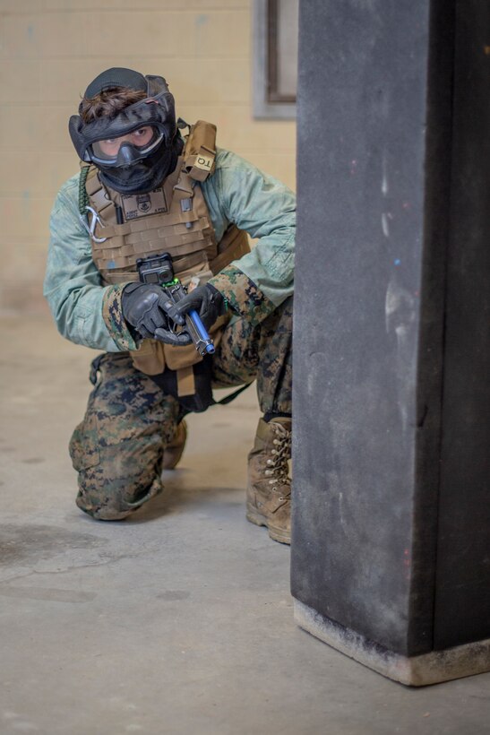 Staff Sgt. Ramon Perez, a criminal investigator with Special Purpose Marine Air-Ground Task Force - Southern Command, defends his position against opposing forces during a field exercise at Camp Lejeune, North Carolina, May 7, 2020. Marines reversed their blouse inside-out to simulate enemy forces during training. The Marines train and perform a variety of infantry skill evaluations during the field exercise to help sharpen their overall capabilities. These training events assist the Marines and Sailors when working alongside partner nations in Latin America and the Caribbean with crisis response preparedness, security cooperation training, and engineering projects. Perez is a native of Newark, New Jersey. (U.S. Marine Corps photo by Cpl. Benjamin D. Larsen)