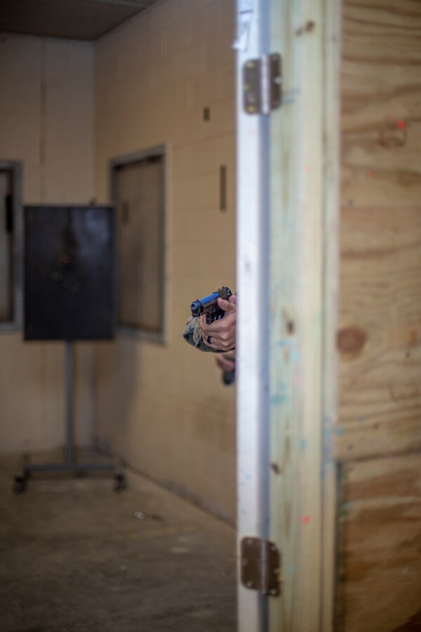 A Marine with Special Purpose Marine Air-Ground Task Force - Southern Command practices clearing a room during a field exercise at Camp Lejeune, North Carolina, May 7, 2020. The Marines train and perform a variety of infantry skill evaluations during the field exercise to help sharpen their overall capabilities. These training events assist the Marines and Sailors when working alongside partner nations in Latin America and the Caribbean with crisis response preparedness, security cooperation training, and engineering projects. (U.S. Marine Corps photo by Cpl. Benjamin D. Larsen)