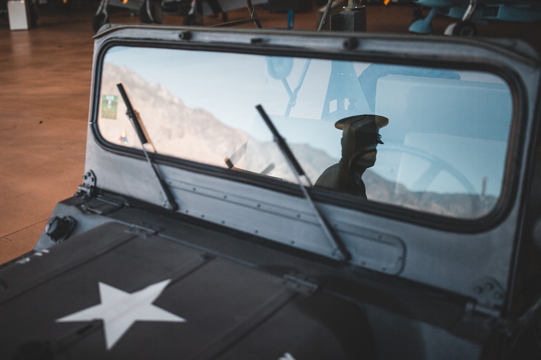 A U.S. Marine awaits the commencement of the Memorial Day ceremonial flyover at the Palm Springs Air Museum, Palm Springs, Calif., May 25.