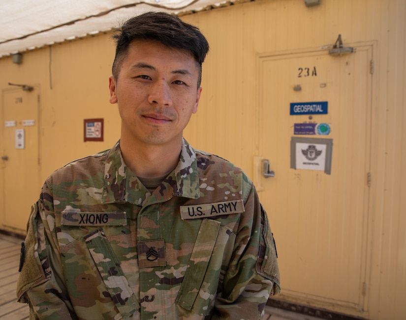 Staff Sgt. Nhia Xiong prepares to print a tactical map in his office while he is deployed to the Middle East with the Headquarters & Headquarters Company, 34th Expeditionary Combat Aviation Brigade. His role as the geospatial non-commissioned officer in charge is to oversee the creation and printing of maps used by other units in his area of operations for missions that support of Operation Spartan Shield and Operation Inherent Resolve.