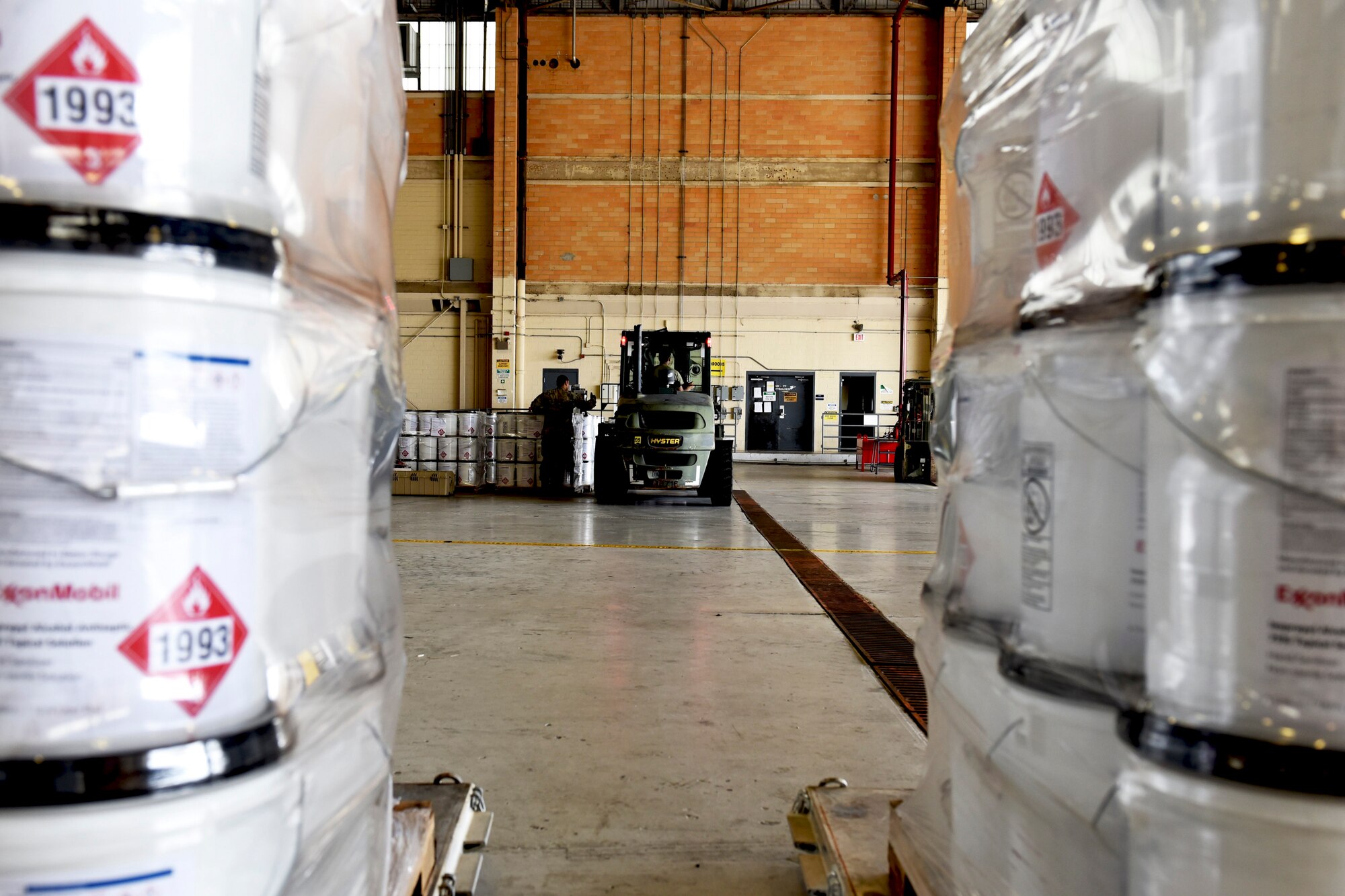 Photo of Airman guiding a forklift