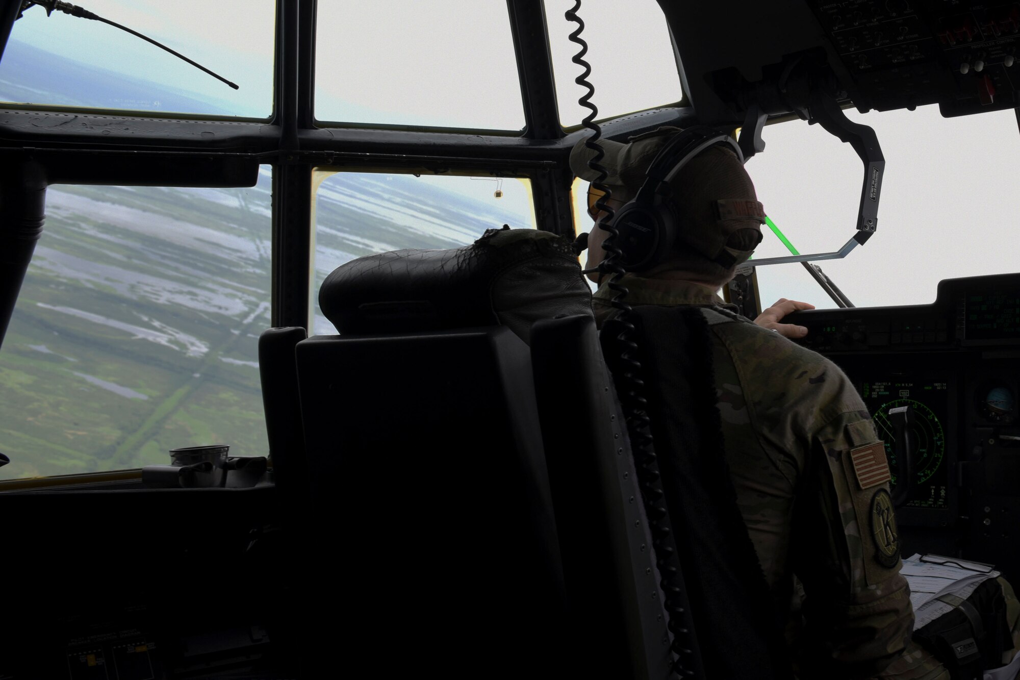Photo of Airman in aircraft