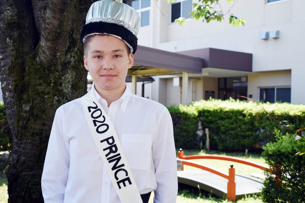 Student poses for his prom photo.