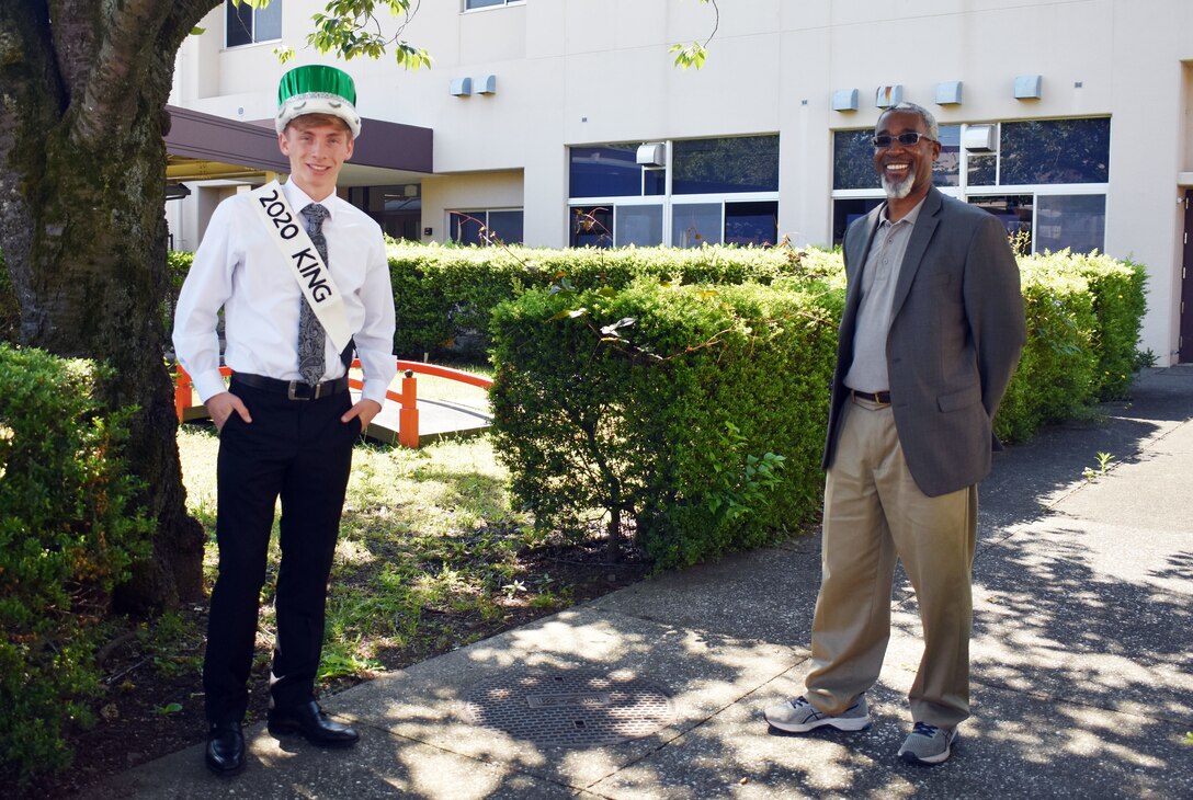 Student and principal pose for a photo.