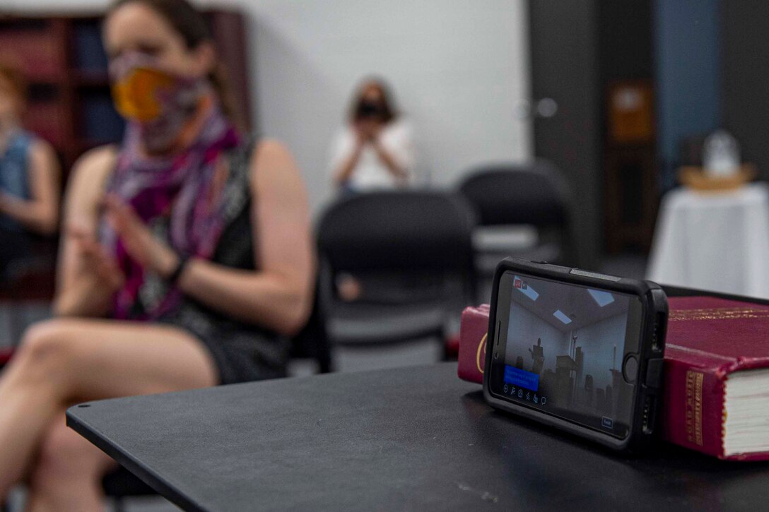 Photo of a phone recording a service.