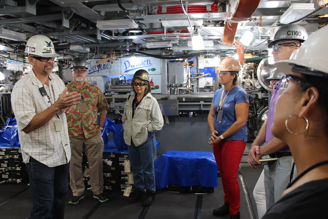 USS Missouri (SSN 780) Project Superintendent Chad Nishida
explains to Code 1160 Congressional and Public Affairs Office the importance of getting submarines out on time to help support our nations defense as we face threats from adversaries in the Pacific.