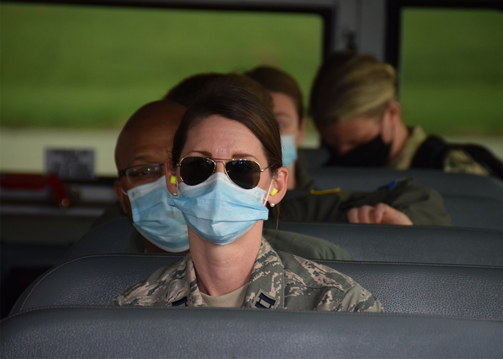 Capt. Sarah Arrellano, 433rd Aeromedical Staging Squadron clinical nurse, one of 10 Reserve Citizen Airmen returning home from New York City, waits on a bus for transportation to lodging May 28, 2020 at Joint Base San Antonio-Lackland, Texas.