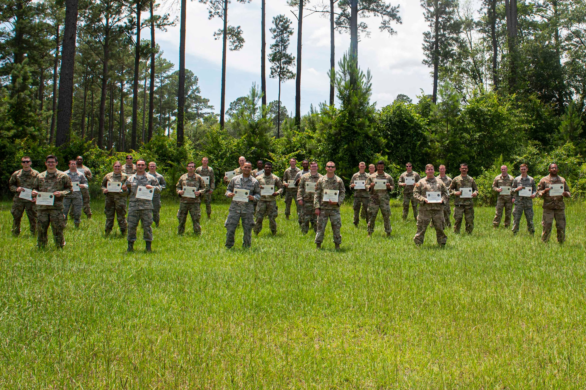 Photo of graduates of the Multi-Capable Airmen course posing for a photo.