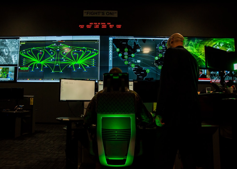 Marines pose for photos in the cyber operations center at Lasswell Hall aboard Fort Meade, Maryland, Feb. 5.
