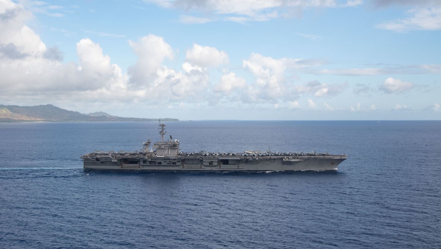 PHILIPPINE SEA (June 4, 2020) The aircraft carrier USS Theodore Roosevelt (CVN 71) departs Apra Harbor July 4, 2020. Following an extended visit to Guam in the midst of the COVID-19 global pandemic, Theodore Roosevelt is returning to operational tasking during a deployment to the Indo-Pacific.