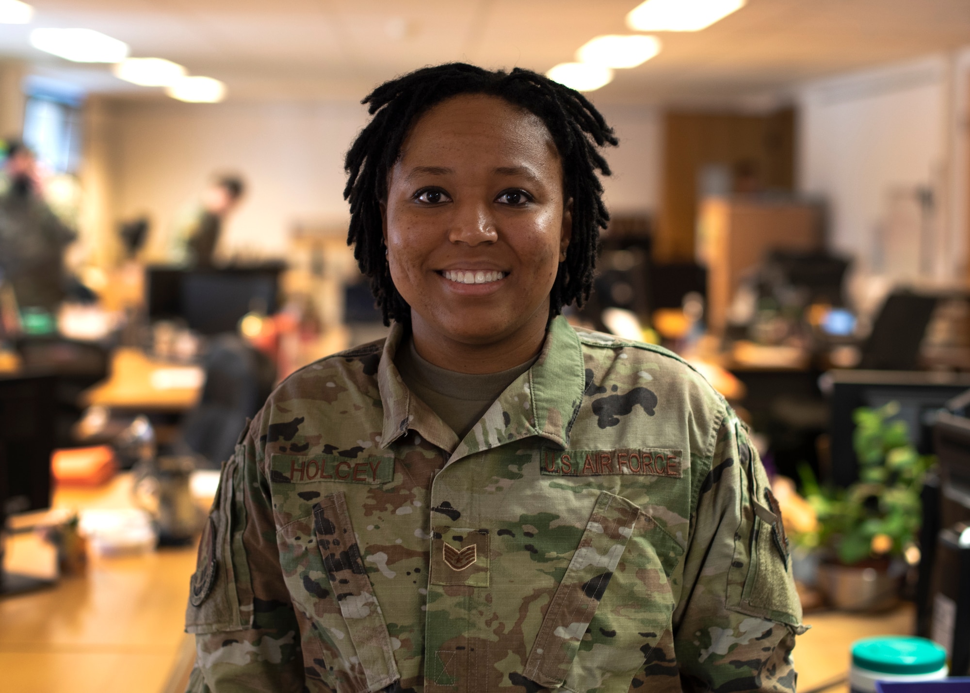 U.S. Air Force Staff Sgt. Jasmine Holcey, 786th Force Support Squadron relocations supervisor, poses for a photo in the base relocations office at Ramstein Air Base, Germany, June 1, 2020.