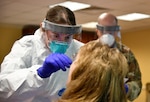U.S. Air Force Tech. Sgt. Danielle Fary, 110th Medical Group, 110th Attack Wing, Michigan Air National Guard, conducts COVID-19 testing of employees at Riveridge Rehabilitation and Healthcare Center, Niles, Michigan, May 28, 2020. As of May, more than 1,000 Michigan Guard Soldiers and Airmen were actively supporting the state’s COVD-19 response.