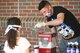 Airman 1st Class Christopher Anderson, 66th Security Forces Squadron entry controller, makes snow cones as part of the “We Care” project at Hanscom Air Force Base., Mass. May 27. Anderson and other 66 SFS members volunteered during the event that allowed the base community to enjoy the outdoors while maintaining physical distancing. (U.S. Air Force photo by Todd Maki)