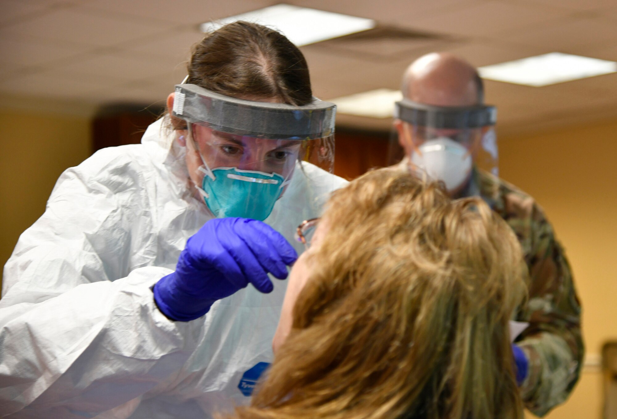U.S. Air Force Tech. Sgt. Danielle Fary, 110th Medical Group, 110th Attack Wing, Michigan Air National Guard, conducts COVID-19 testing of employees at Riveridge Rehabilitation and Healthcare Center, Niles, Michigan, May 28, 2020. As of May, more than 1,000 Michigan Guard Soldiers and Airmen were actively supporting the state’s COVD-19 response.
