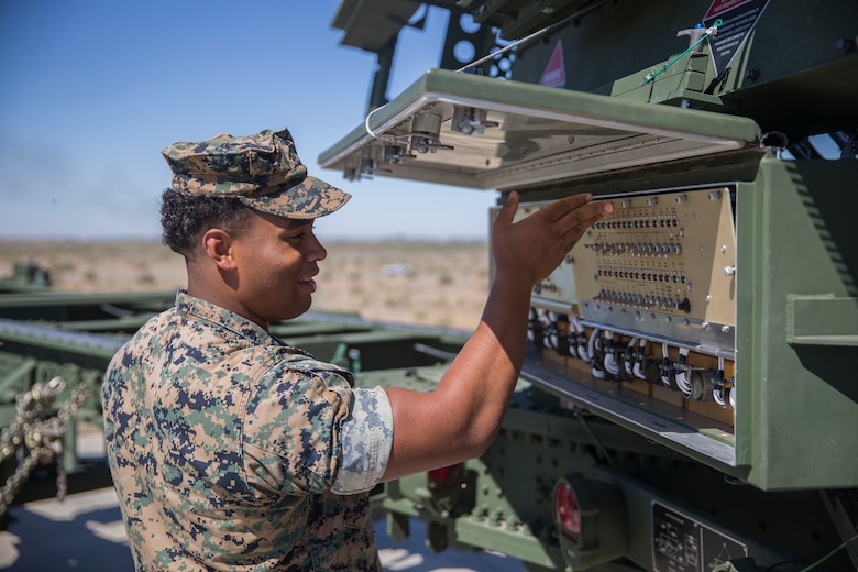 U.S. Marines with Marine Air Control Squadron (MACS) 1, Marine Corps Air Station (MCAS) Yuma, conduct a routine check up on an AN/TPS-59 Radar on Cannon Air Defense Complex, MCAS Yuma April 5, 2020. The AN/TPS-59 Radar is a long-range transportable radar system used to detect and track threats to MAGTF operations. (U.S. Marine Corps Photo by Lance Cpl. John Hall)