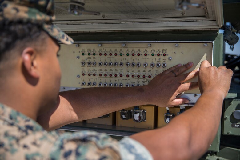 U.S. Marines with Marine Air Control Squadron (MACS) 1, Marine Corps Air Station (MCAS) Yuma, conduct a routine check up on an AN/TPS-59 Radar on Cannon Air Defense Complex, MCAS Yuma April 5, 2020. The AN/TPS-59 Radar is a long-range transportable radar system used to detect and track threats to MAGTF operations. (U.S. Marine Corps Photo by Lance Cpl. John Hall)