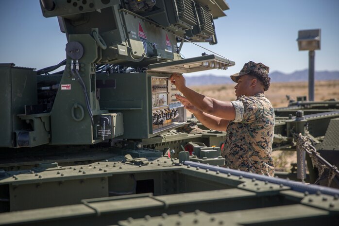 U.S. Marines with Marine Air Control Squadron (MACS) 1, Marine Corps Air Station (MCAS) Yuma, conduct a routine check up on an AN/TPS-59 Radar on Cannon Air Defense Complex, MCAS Yuma April 5, 2020. The AN/TPS-59 Radar is a long-range transportable radar system used to detect and track threats to MAGTF operations. (U.S. Marine Corps Photo by Lance Cpl. John Hall)