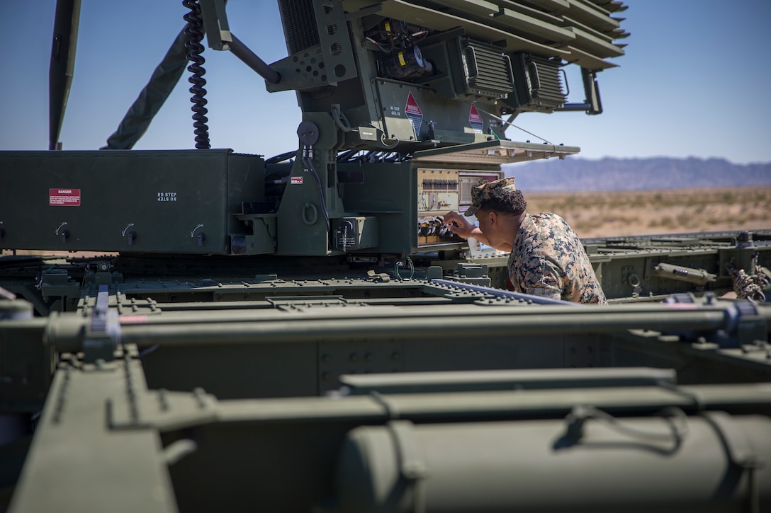 U.S. Marines with Marine Air Control Squadron 1, Marine Corps Air Station (MCAS) Yuma, conduct a routine check up on an AN/TPS-59 Radar on Cannon Air Defense Complex, MCAS Yuma April 5, 2020. The AN/TPS-59 Radar is a long-range transportable radar system used to detect and track threats to MAGTF operations. (U.S. Marine Corps Photo by Lance Cpl. John Hall)
