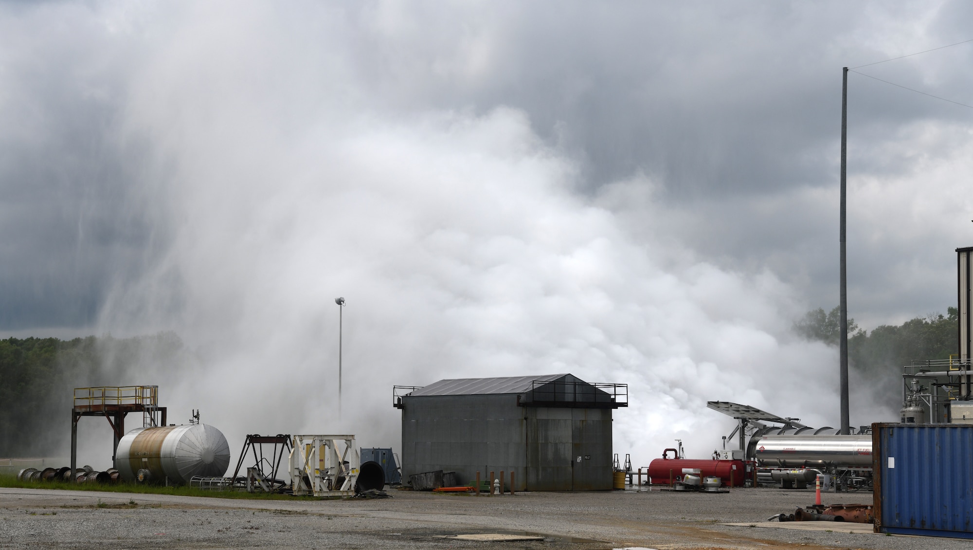 Exhaust and cooling water shoot out the back of the Aerodynamic and Propulsion Test Unit during a test at Arnold Air Force Base, Tenn., May 5, 2020. Arnold Engineering Development Complex (AEDC) team members are taking measures to mitigate the risk of transmission of coronavirus so they may continue performing the critical national defense mission of AEDC. (U.S. Air Force photo by Jill Pickett)