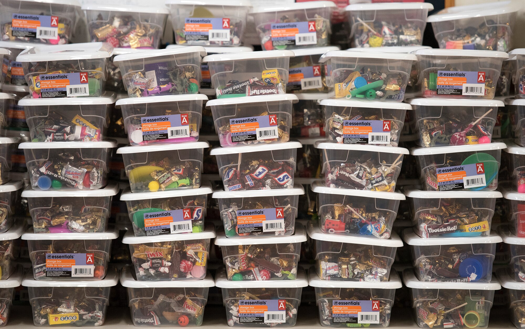 Containers filled with candy, knickknacks and toys are stacked up.