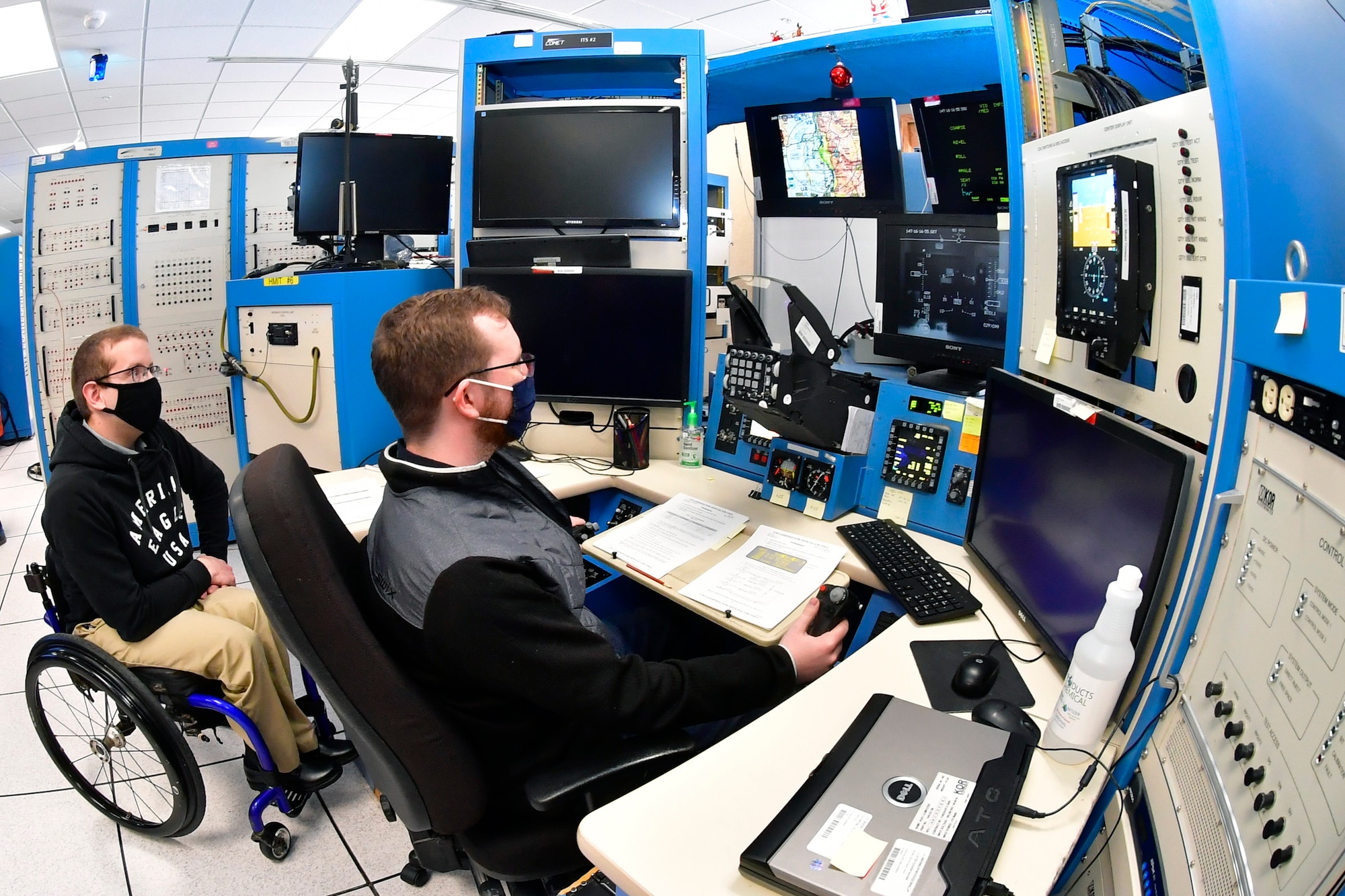 Austin Eberle and Collin Lindeman, both System Test engineers, 518 Software Engineering Squadron, preform software test and evaluation on an F-16 simulator, May 26, 2020, at Hill Air Force Base, Utah. (U.S Air Force photo by Todd Cromar)