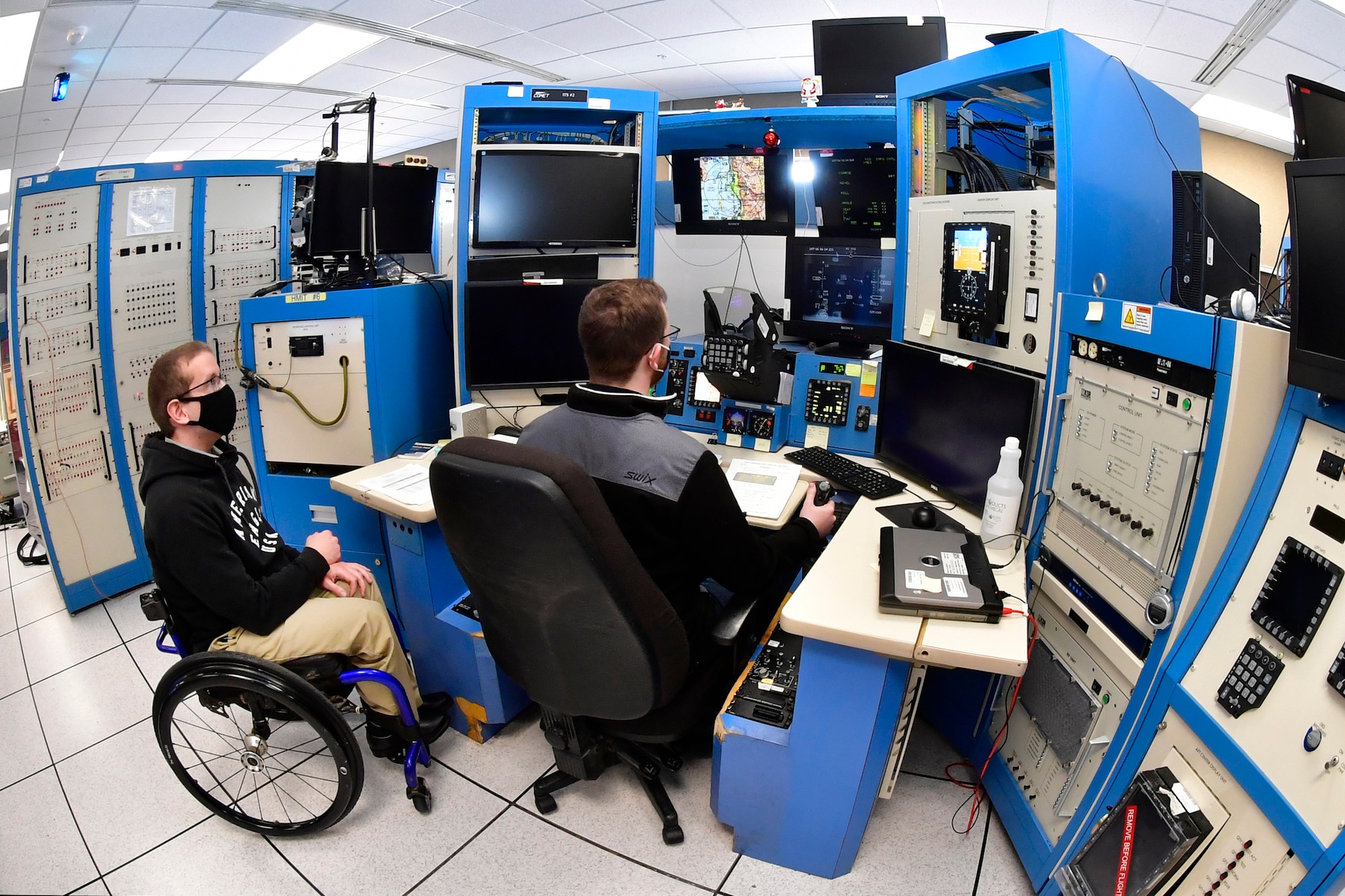 Austin Eberle and Collin Lindeman, both system test engineers in the 518th Software Engineering Squadron, preform software test and evaluation on an F-16 simulator, May 26, 2020, at Hill Air Force Base, Utah. (U.S Air Force photo by Todd Cromar)