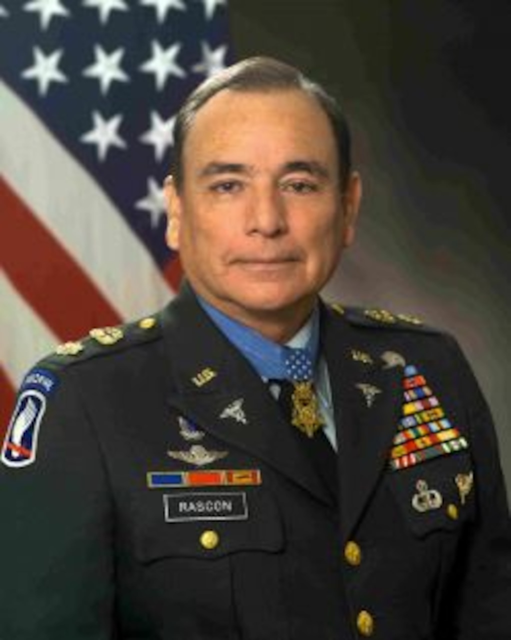 A man in a military uniform wears a Medal of Honor.