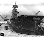 USS Yorktown (CV-5) in Dry Dock 1 at the Pearl Harbor Navy Yard, 29 May 1942, receiving urgent repairs for damage received in the Battle of Coral Sea. She left Pearl Harbor the next day to participate in the Battle of Midway.