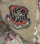 An Air Mobility Command patch is worn on the sleeve of Senior Airman Allison Payne, 628th Air Base Wing Public Affairs photojournalist, at Joint Base Charleston S.C., May 31, 2020. Deployments are necessary for military members in order to ensure rapid global mobility for whenever an operation is needed to be carried out; furthermore, deployments are an opportunity for military members to expand their knowledge and work in different environments.