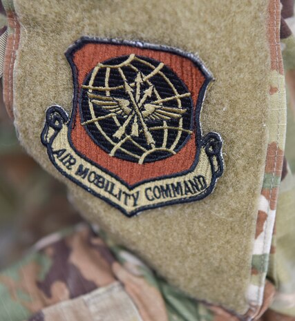 An Air Mobility Command patch is worn on the sleeve of Senior Airman Allison Payne, 628th Air Base Wing Public Affairs photojournalist, at Joint Base Charleston S.C., May 31, 2020. Deployments are necessary for military members in order to ensure rapid global mobility for whenever an operation is needed to be carried out; furthermore, deployments are an opportunity for military members to expand their knowledge and work in different environments.