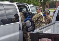 Members of Joint Base Charleston load into a van as they prepare to leave for a deployment at Joint Base Charleston S.C., May 31,2020. Deployments are necessary for military members in order to ensure rapid global mobility for whenever an operation is needed to be carried out; furthermore, deployments are an opportunity for military members to expand their knowledge and work in different environments.