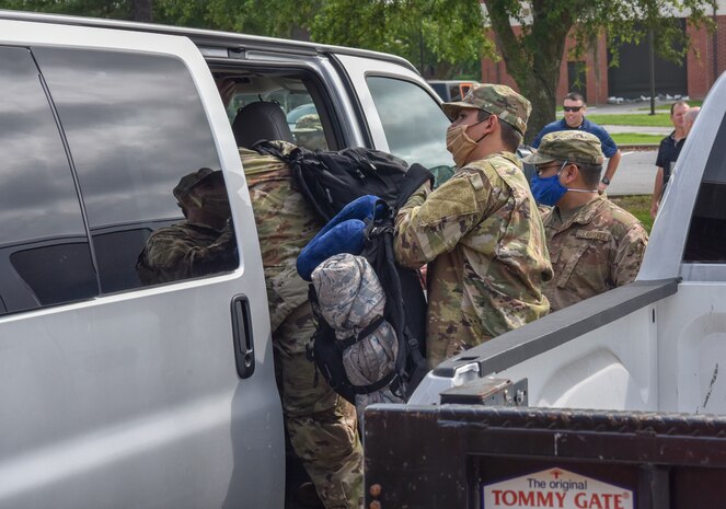 Members of Joint Base Charleston load into a van as they prepare to leave for a deployment at Joint Base Charleston S.C., May 31,2020. Deployments are necessary for military members in order to ensure rapid global mobility for whenever an operation is needed to be carried out; furthermore, deployments are an opportunity for military members to expand their knowledge and work in different environments.