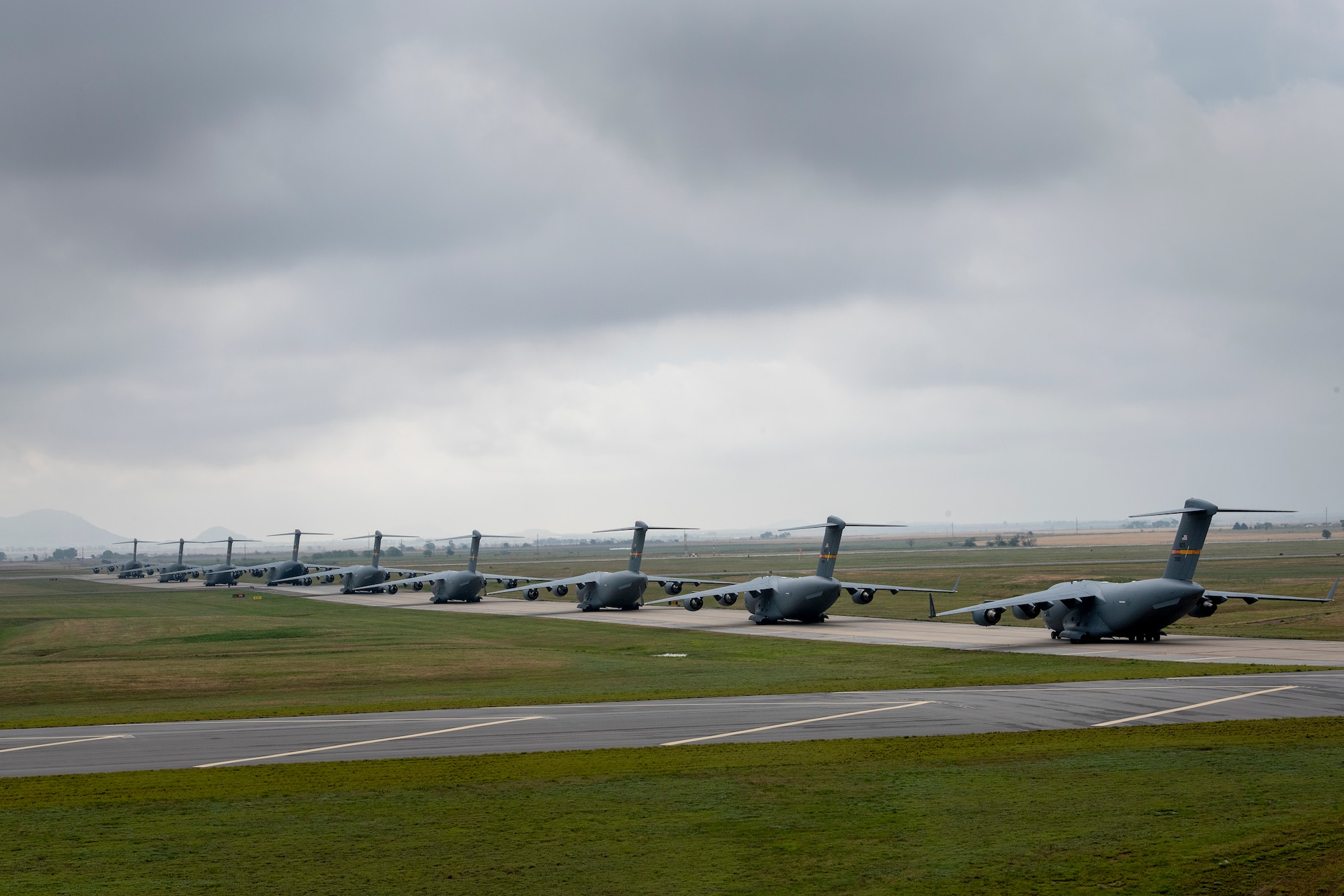 U.S. Air Force C-17 Globemaster IIIs line up for departure at Altus Air Force Base, Oklahoma, during a large formation exercise, May 21, 2020.