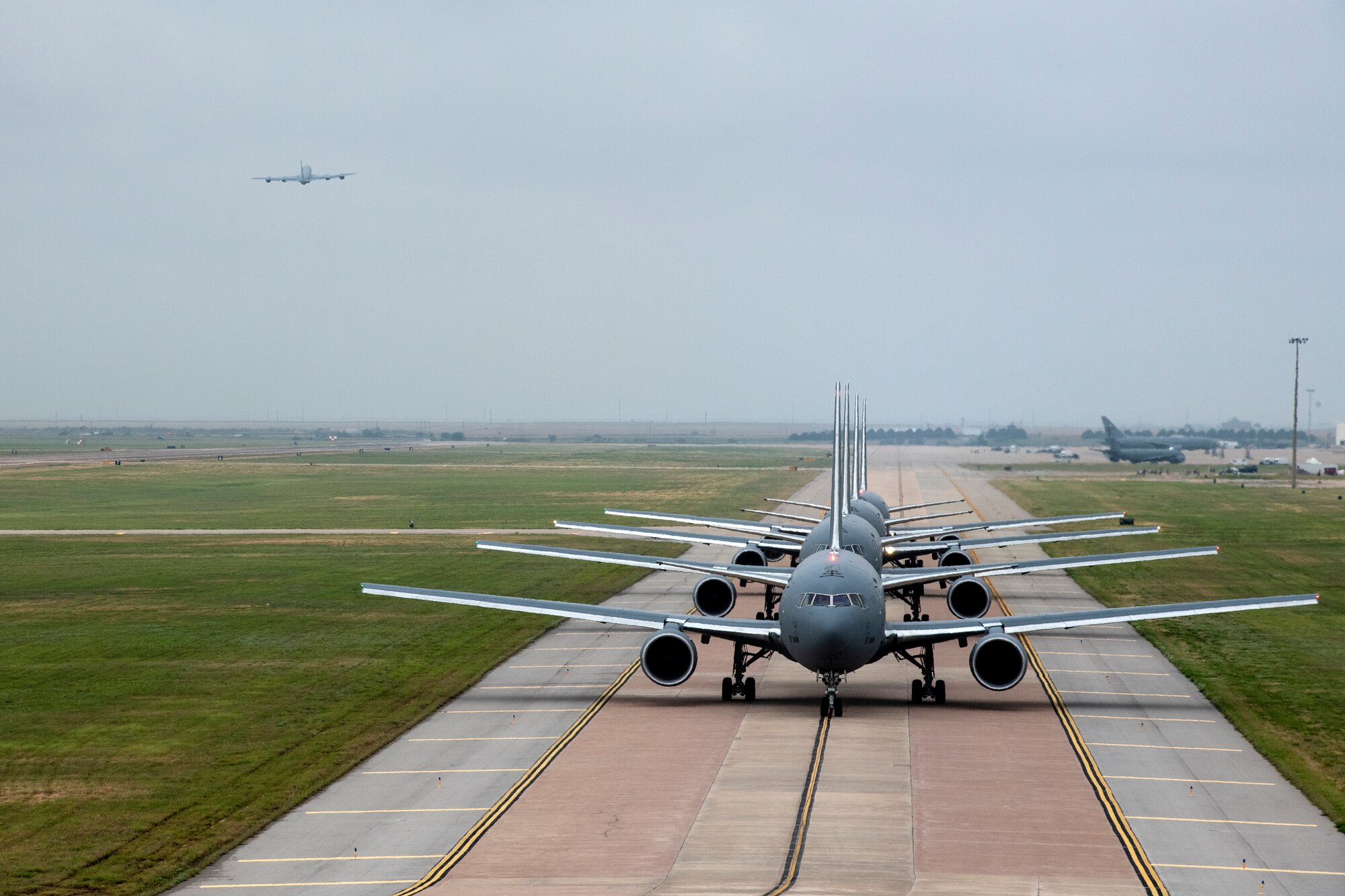 U.S. Air Force KC-46 Pegasus aircraft line up for departure at Altus Air Force Base, Oklahoma, during a large formation exercise, May 21, 2020.