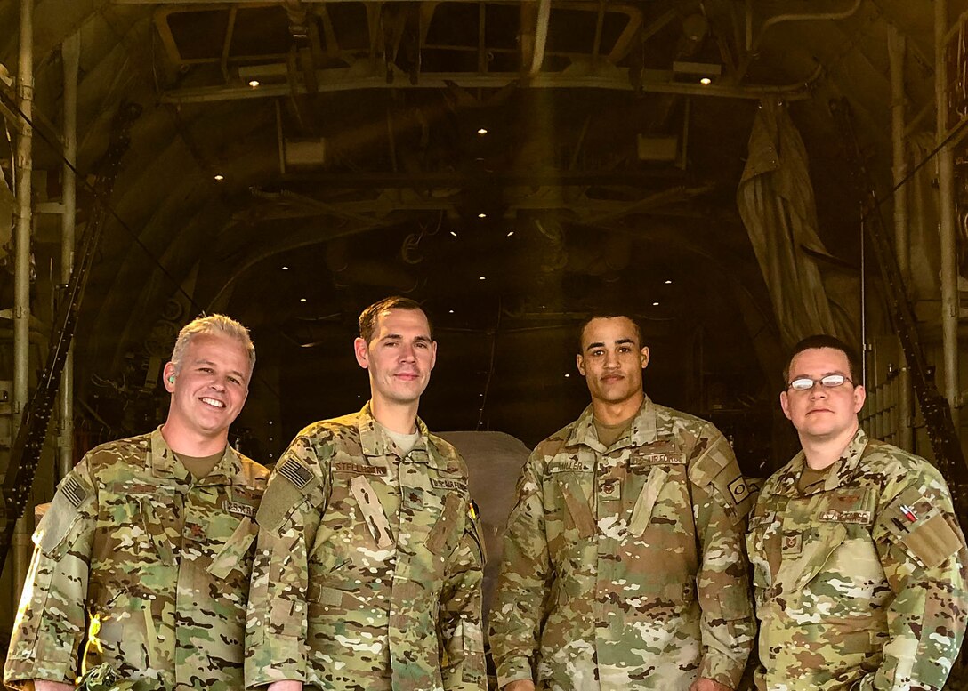 Maj. Andrew Gillis (left), Maj. Ryan Stellhorn (left center), Tech. Sgt. Anthony Miller (right center), and Tech. Sgt. Anthony Miller pose in the cargo area of a C-130J before a mission while assigned to the 746th Expeditionary Airlift Squadron in early 2019. The Air Force Reserve 913th Airlift Group recently was named the recipient of the 2019 General James H. Doolittle Trophy by Air Mobility Command. The award was established by the Air Force Historical Foundation as a way to recognize a unit that has displayed bravery, determination while accomplishing its mission under difficult conditions. (Courtesy photo)