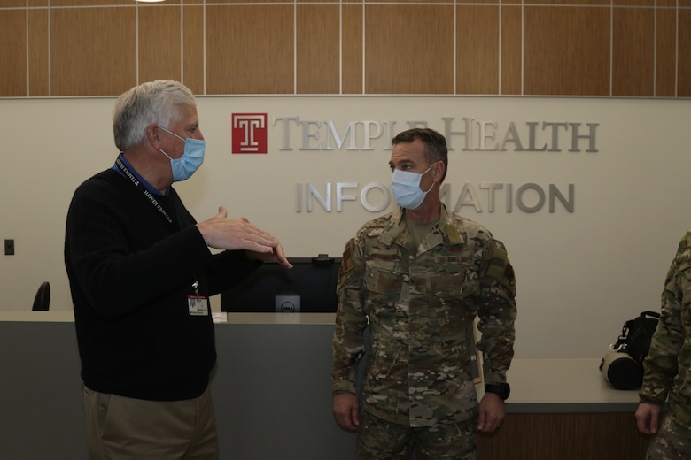 Michael Young, Chief Executive Officer, Temple Health, discusses Temple University Hospital operations with U.S. Air Force Maj. Gen. Chad P. Franks, Task Force-Southeast commander, at Temple University Hospital in Philadelphia, PA, April 27, 2020. Urban Augmentation Medical Task Force 352-1, a U.S. Army Reserve medical task force, is augmenting six Philadelphia area hospitals and the Temple Coronavirus Surge Facility to support Philadelphia COVID-19 relief efforts. U.S. Northern Command, through U.S. Army North, is providing military support to the Federal Emergency Management Agency to help communities in need. (U.S. Army photo by Staff Sgt. Adrian Patoka)
