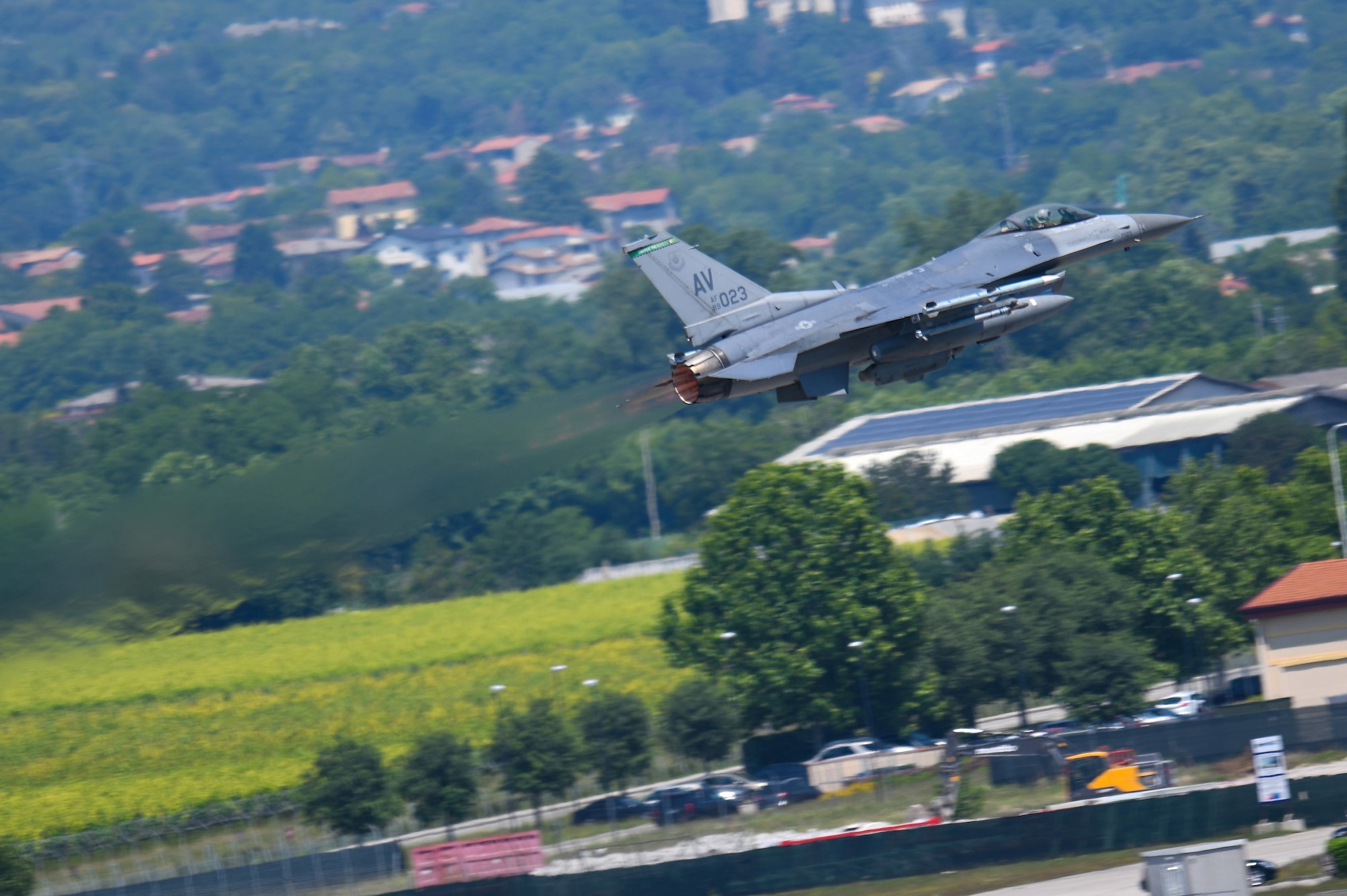 A U.S. Air Force F-16 Fighting Falcon from the 555th Fighter Squadron takes flight during an Elephant Walk and COVID-19 flyover at Aviano Air Base, Italy, June 1, 2020. The Elephant Walk was intended to showcase the continued combat power of Aviano AB and give thanks to first responders, doctors, and all personnel engaged in the battle against COVID-19. (U.S. Air Force photo by Airman 1st Class Ericka A. Woolever).