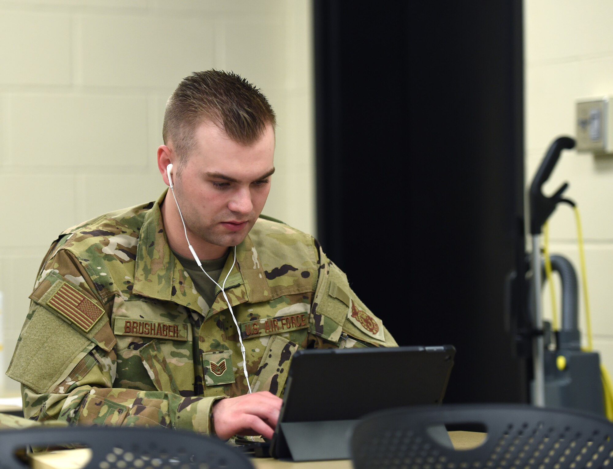 Staff Sgt. Jonathan Brushaber, 132d Wing firefighter, conducts a contact tracing call with a COVID-19 patient May 29, 2020, at the Camp Dodge in Johnston, Iowa. The call center assists the Iowa Department of Public Health with contact tracing. (U.S. Air National Guard photo by Staff Sgt. Michael J. Kelly)