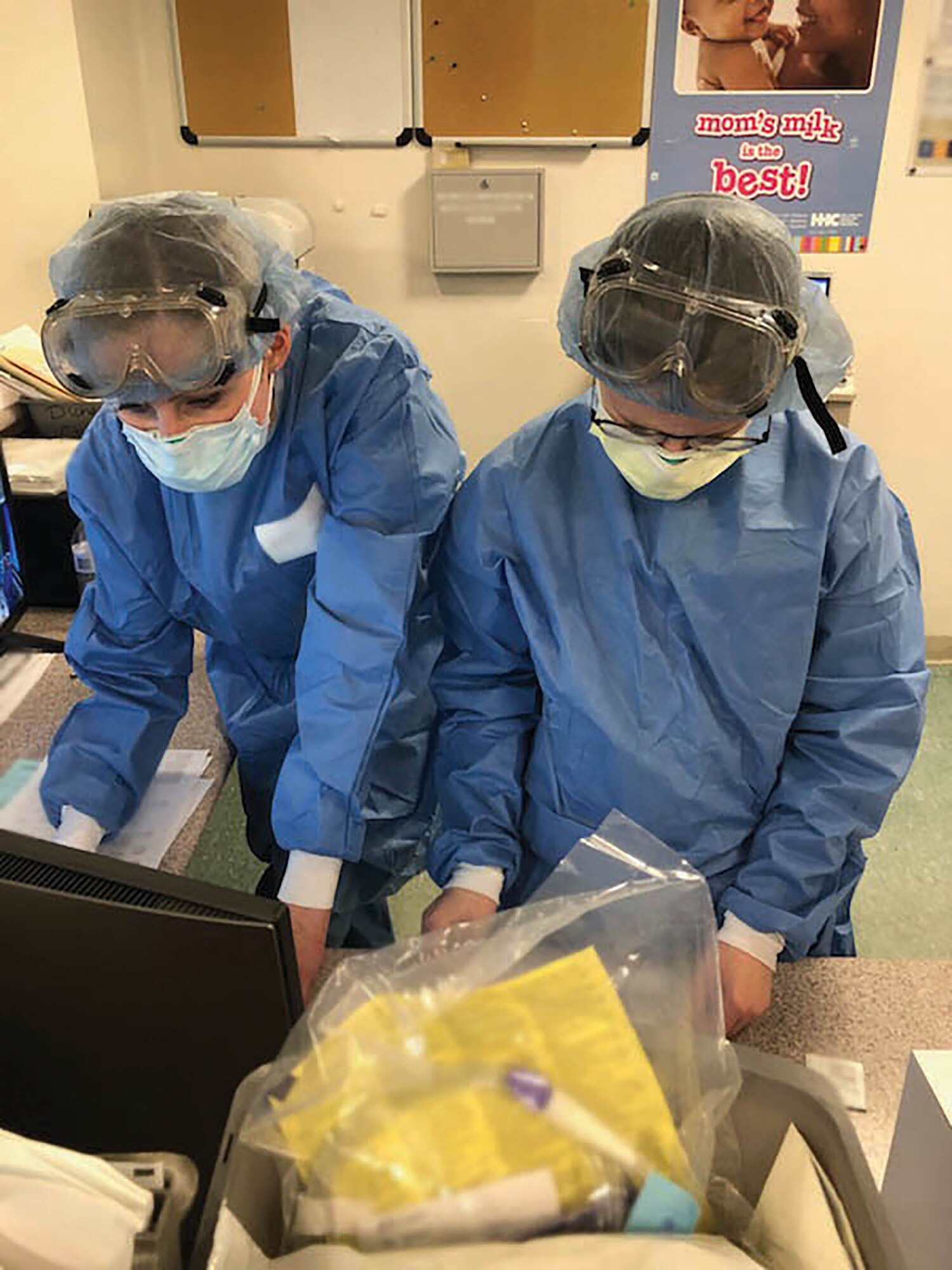 Capts. Kristina Fleming and Trisha Degilormo from the 445th Aeromedical Staging Squadron perform medical duties while providing care to patients at Lincoln Hospital in The Bronx, New York, May 5, 2020. While in New York, Fleming, Degilormo and several other nurses from ASTS were working in the intensive care unit, neonatal intensive care unit and the emergency department to support patients battling COVID-19.