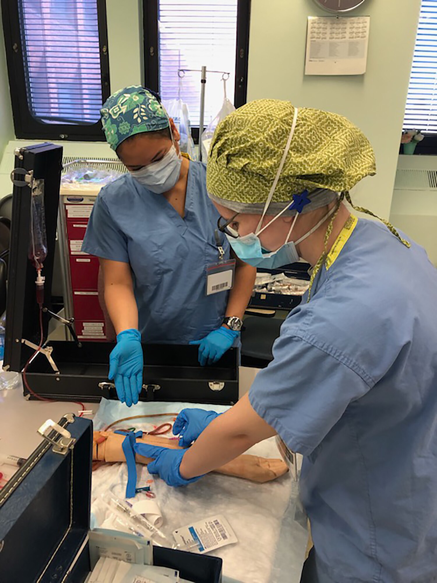 Capt. Trisha Degilormo and 1st Lt. Jennifer Gerritsen participate in skills training with the Lincoln nursing staff while serving on the front line of COVID-19 in New York City, New York in early April, 2020. The group partnered with civilian and military counterparts to support the Lincoln Medical Center in The Bronx, New York during the pandemic.