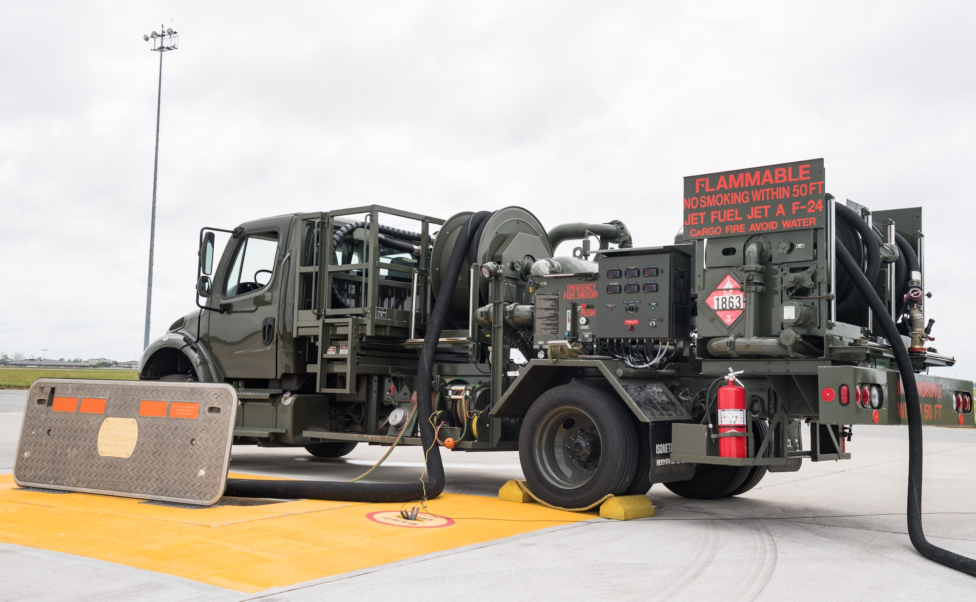 Hoses from an R-12 hydrant service vehicle are 
shown connected to one of three new fuel 
hydrant pits located at the aircraft hot cargo area May 28, 2020, on Dover Air Force Base, Delaware. Maximum-performance tests were conducted on the fuel pump house as Jet-A fuel was pumped through the new hydrant system to each of the fuel hydrant pits. (U.S. Air Force photo by Roland Balik)
