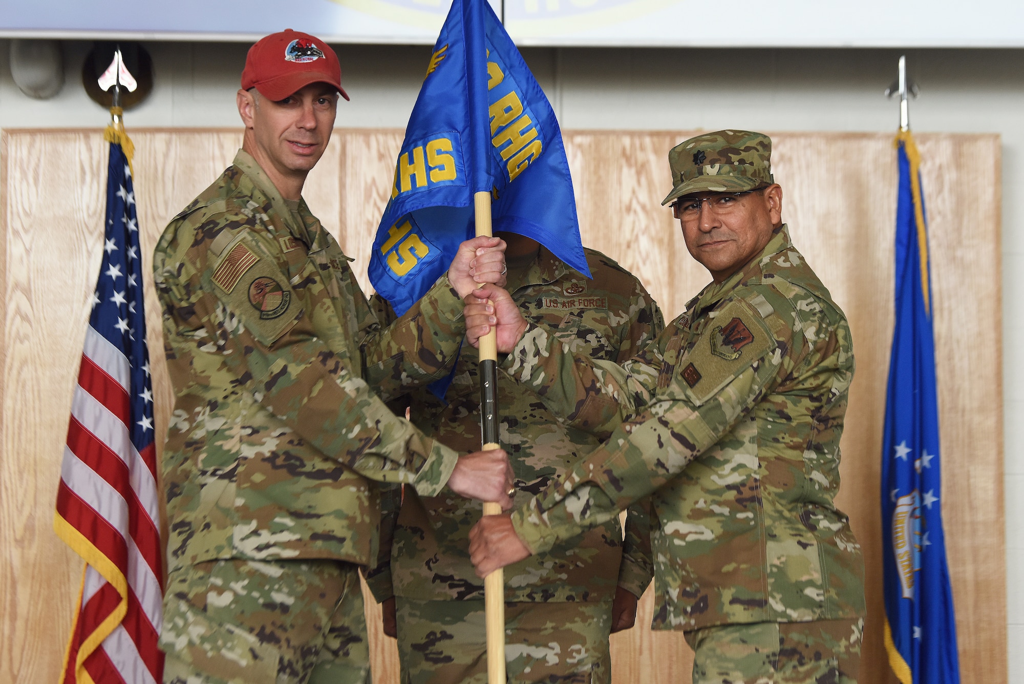Lt. Col. Javier Velazquez, right, accepts command of the 819th RED HORSE Squadron from Col. Jason Loschinskey, 819th RHS outgoing commander, during a change of command ceremony June 3, 2020, at Malmstrom Air Force Base, Mont.