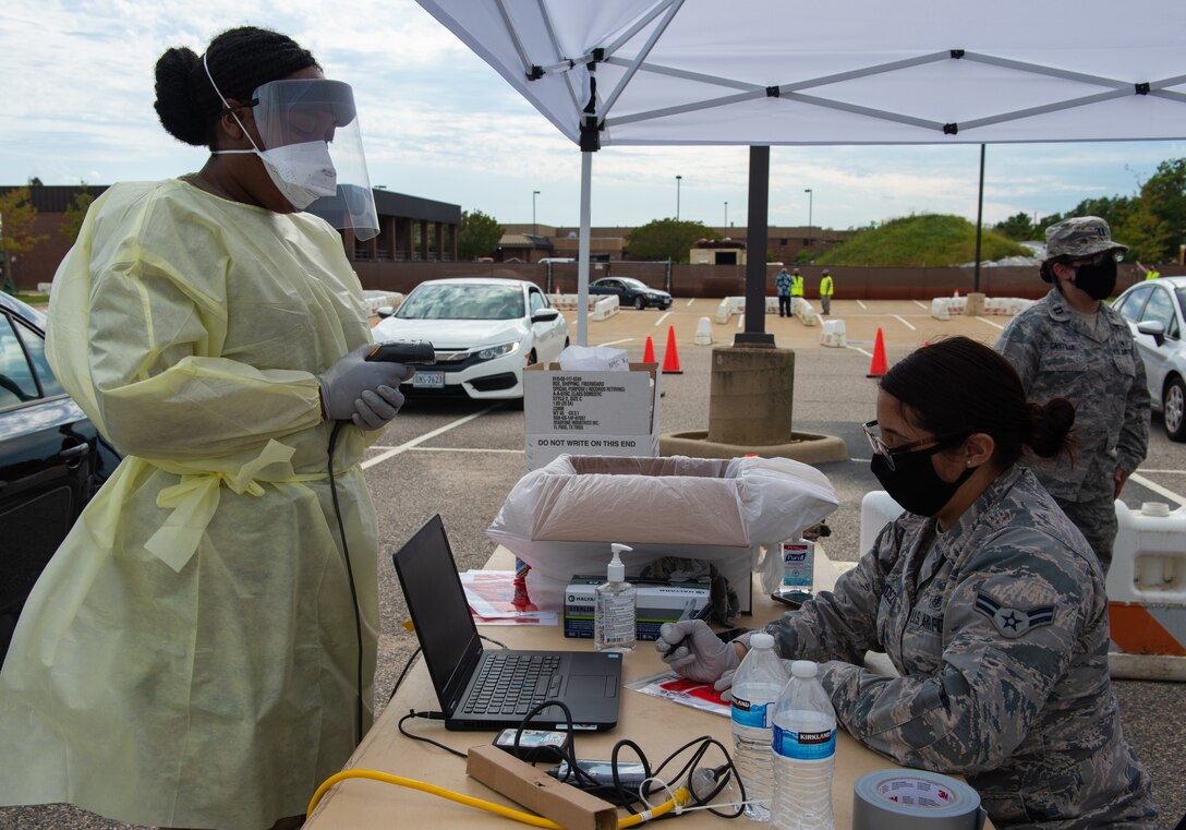 U.S. Air Force Airmen from the 633rd Medical Group administer a new rapid oral fluid COVID-19 test at Joint Base Langley-Eustis, Virginia, June 2, 2020. The 633rd MDG, McDonald Army Health Center and the Air Combat Command Surgeon General’s office were chosen by the Department of Defense as the first units on a military installation to conduct this testing, piloting a new mass rapid testing  system. (U.S. Air Force photo by Airman 1st Class Sara Dowe)