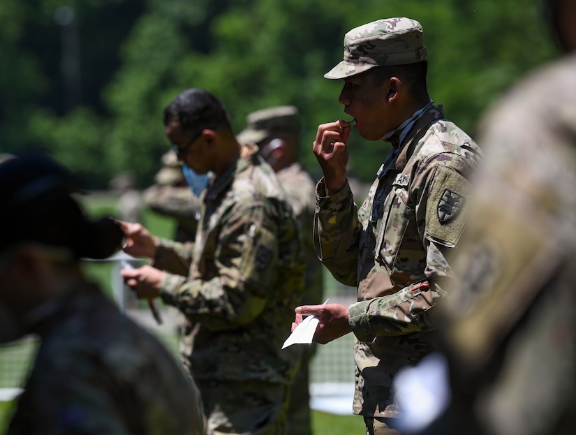 U.S. Army Soldiers participate in mass rapid COVID-19 testing with a mass rapid COVID-19 test at Joint Base Langley-Eustis, Virginia, June 3, 2020. The Department of Defense chose JBLE as the first military installation to conduct testing of approximately 7,800 service members over a three-day period. (U.S. Air Force photo by Senior Airman Monica Roybal)