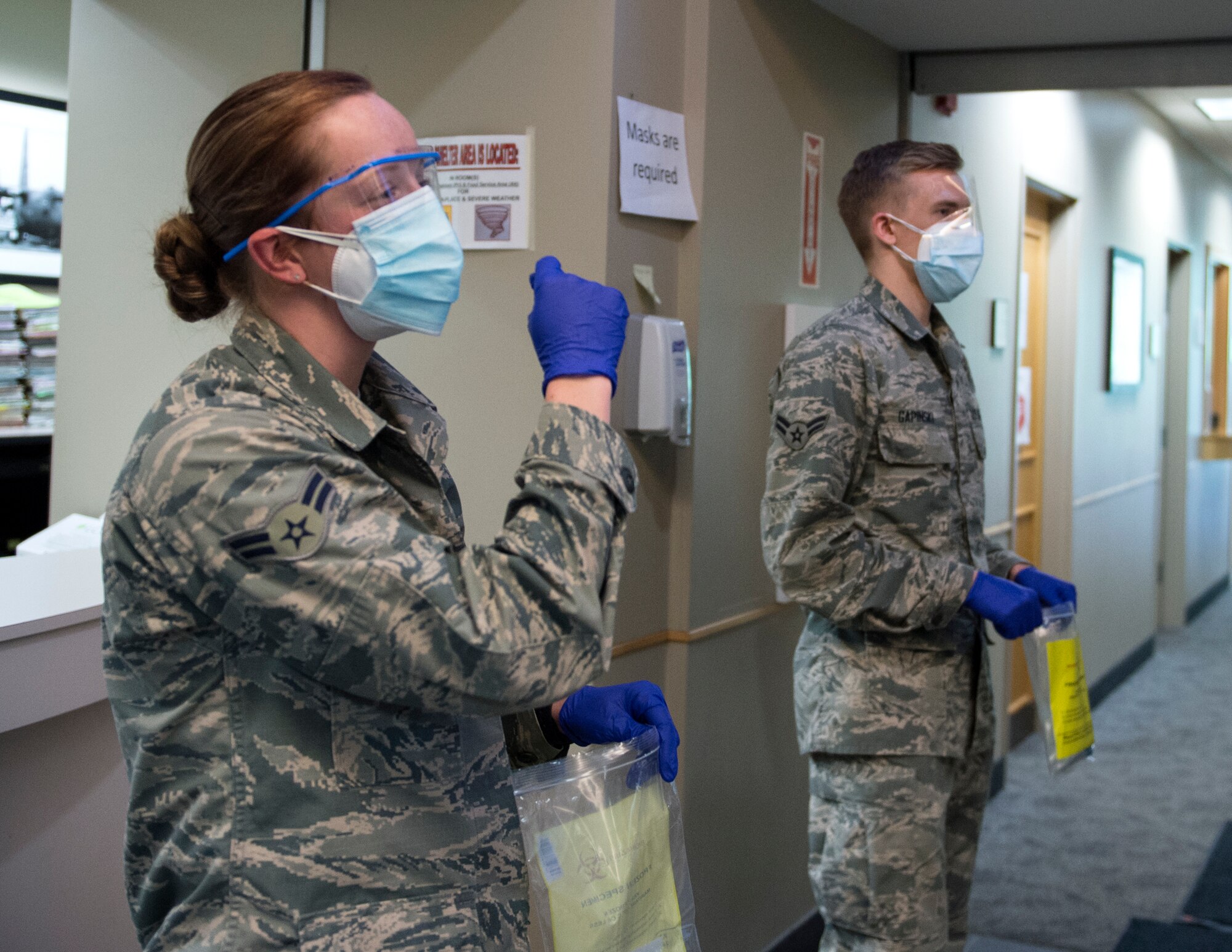 U.S. Air Force Airmen from the 133rd Medical Group, provide instructions on how to administer the COVID-19 test in St. Paul, Minn., June 4, 2020.