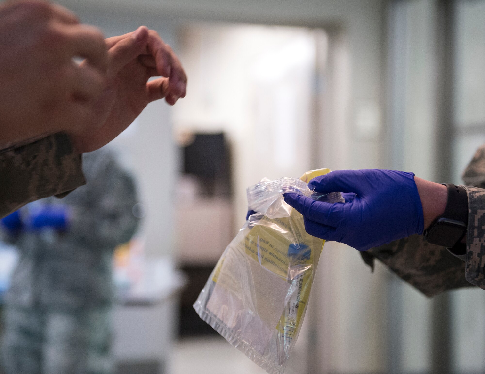 U.S. Air Force Airman from the 133rd Medical Group, collects the COVID-19 test in St. Paul, Minn., June 4, 2020.