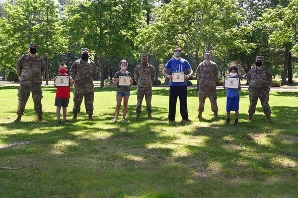 Members of the First Sergeants Council stand behind winners of the 31-day run, walk challenge at Hanscom Air Force Base, June 4. The event took place throughout the month of May, and the 40 participants logged over 3,000 miles. (U.S. Air Force Photo by Todd Maki)